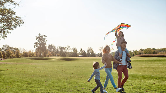 family enjoying time at the park and getting budget-ready this summer