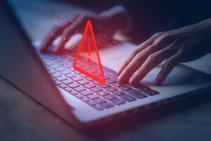 Laptop and red warning sign and cloning sams