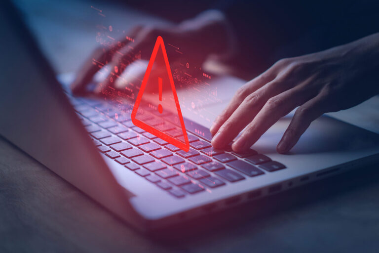 Laptop and red warning sign and cloning sams