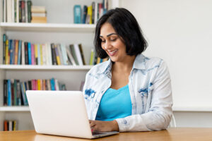 Woman looking at pension on laptop